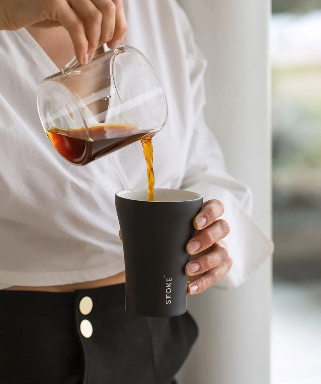 Pouring coffee into a STTOKE cup